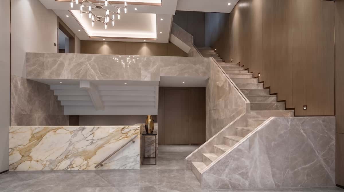 Turkish beige-grey marble staircase project with matching wall cladding and stair side panels Turkish beige-grey marble staircase project with matching wall cladding and stair side panels