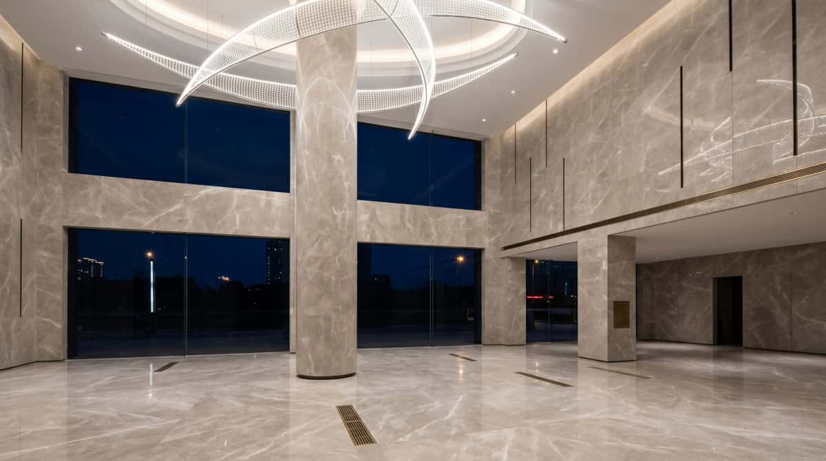 Large interior floor finished with polished Turkish beige-grey marble Large interior floor finished with polished Turkish beige-grey marble