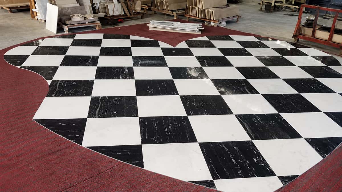 Hotel lobby interior finished with custom marble floor inlay supplied by Aoli Stone