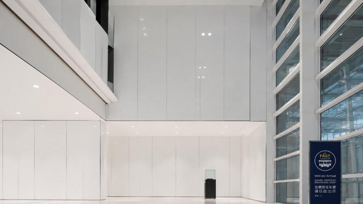 Large-format super white artificial marble wall cladding in Thailand airport interior