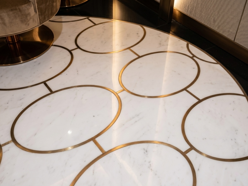 Custom White Marble and Brass Inlay Casino Flooring Project