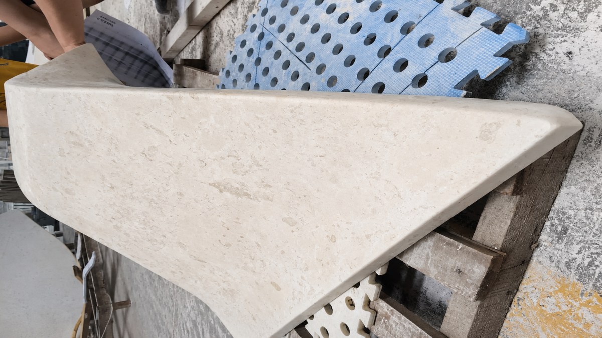Workshop production overview for a custom French limestone sculptural table project