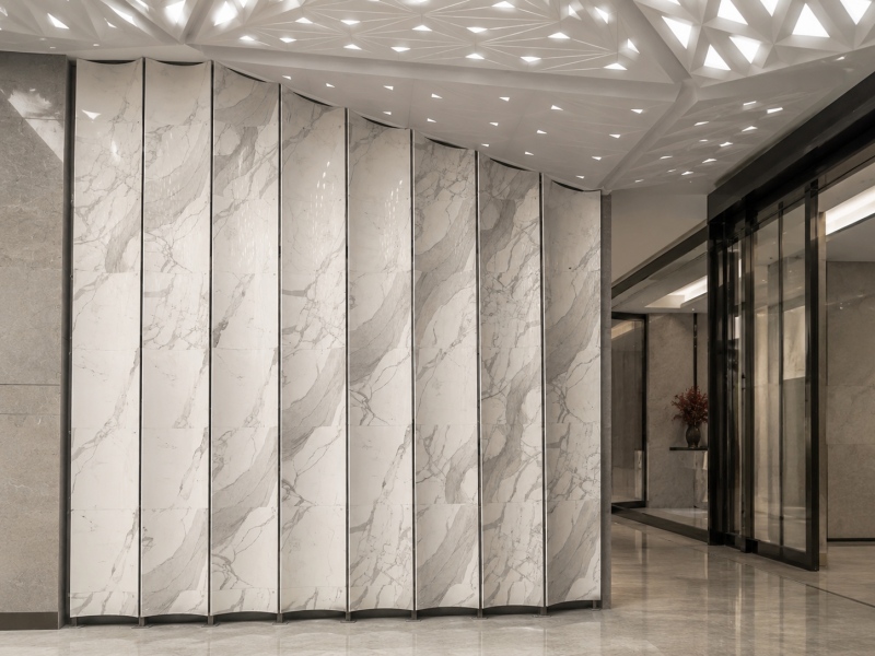 Custom Curved Calacatta White Marble Look Stone Wall Panels for a Modern Commercial Interior