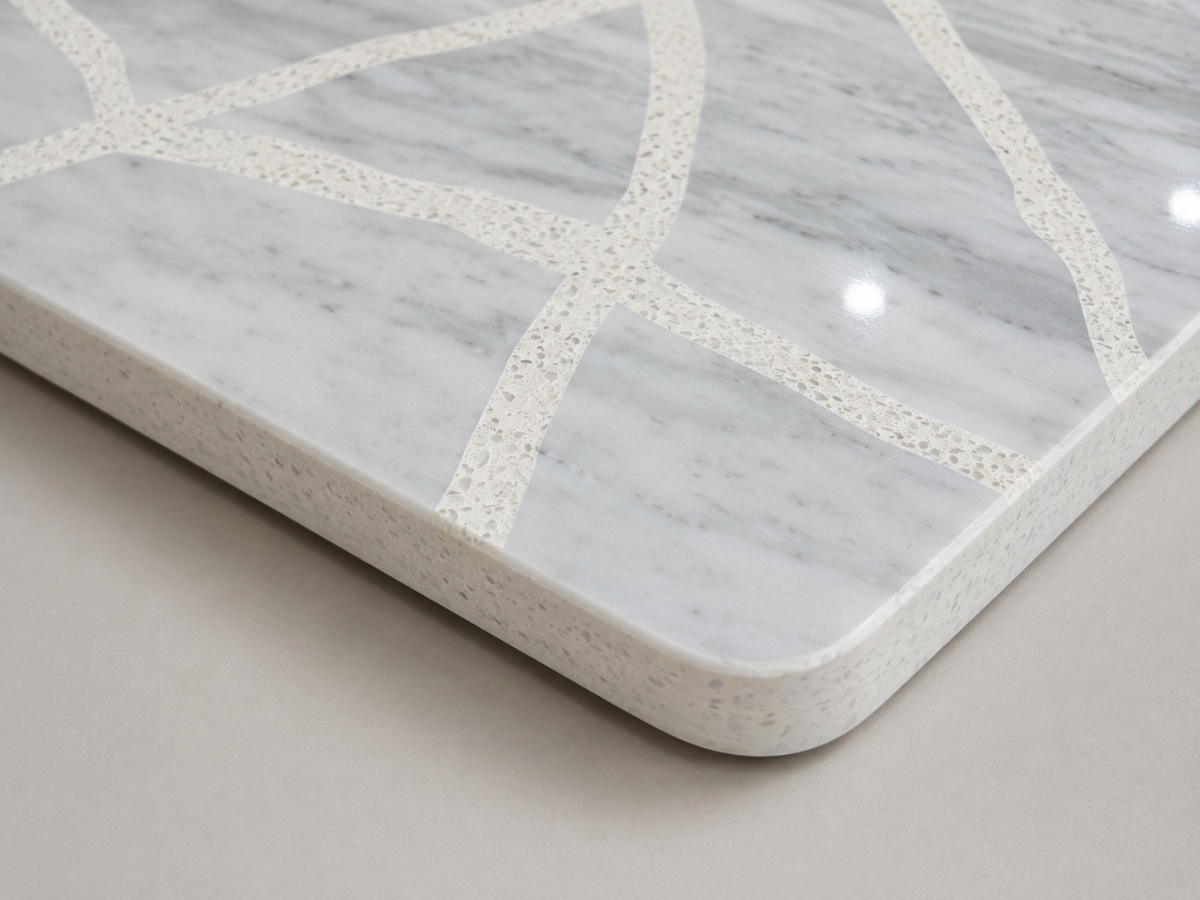 Rounded edge detail of a polished terrazzo and marble custom tabletop