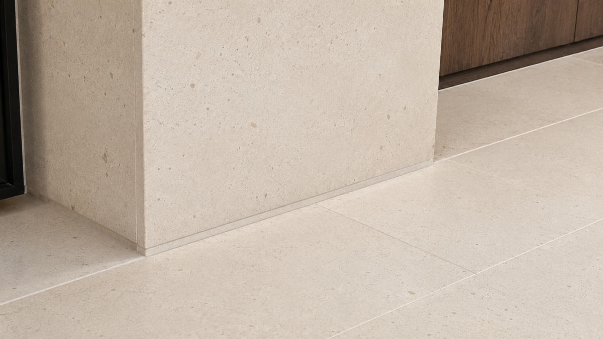 Cotswold Cream Limestone Flooring Tiles Cotswold Cream limestone floor tiles arranged in a project layout, showing warm cream beige tone, fine fossil texture, subtle color variation, and matte natural surface
