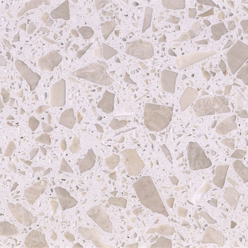 Magnolia White large-chip terrazzo used in a realistic hospitality interior with warm-white matrix and pale beige aggregates