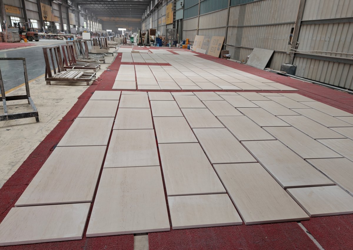 Cut-to-size linear limestone panels dry-laid in grain direction before packing